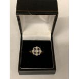 AN 18 CARAT GOLD DIAMOND AND SAPPHIRE RING IN AN ART DECO STYLE SIZE N WITH A PRESENTATION BOX