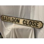 A CAST METAL STREET SIGN 'BASILDON CLOSE' 110CM X 15CM