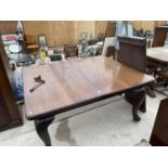 AN EDWARDIAN WIND OUT DINING TABLE ON CABRIOLE LEGS. 57" X 47" TO INCLUDE TWO LEAVES EACH 17.5" NO