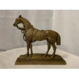 A BRASS DOOR STOP IN THE DESIGN OF A HORSE