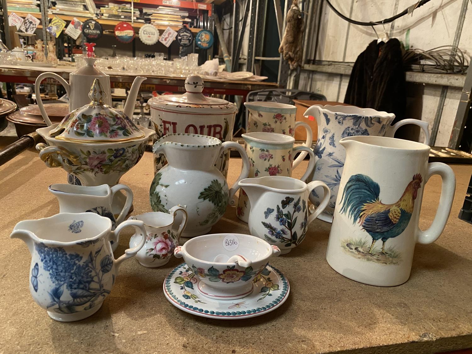 SEVERAL MEDIUM AND LARGE JUGS IN DIFFERENT DECORATIVE STYLES, A SMALL BOWL AND A FLOUR STORAGE JAR - Image 2 of 5