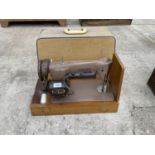 A VINTAGE SINGER ELECTRIC SEWING MACHINE