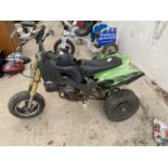 A CHILDRENS PETROL QUAD BIKE