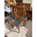 A SET OF FOUR OAK EARLY 20TH CENTURY DINING CHAIRS