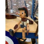 A WOODED ARTICULATED PINOCCHIO FIGURE