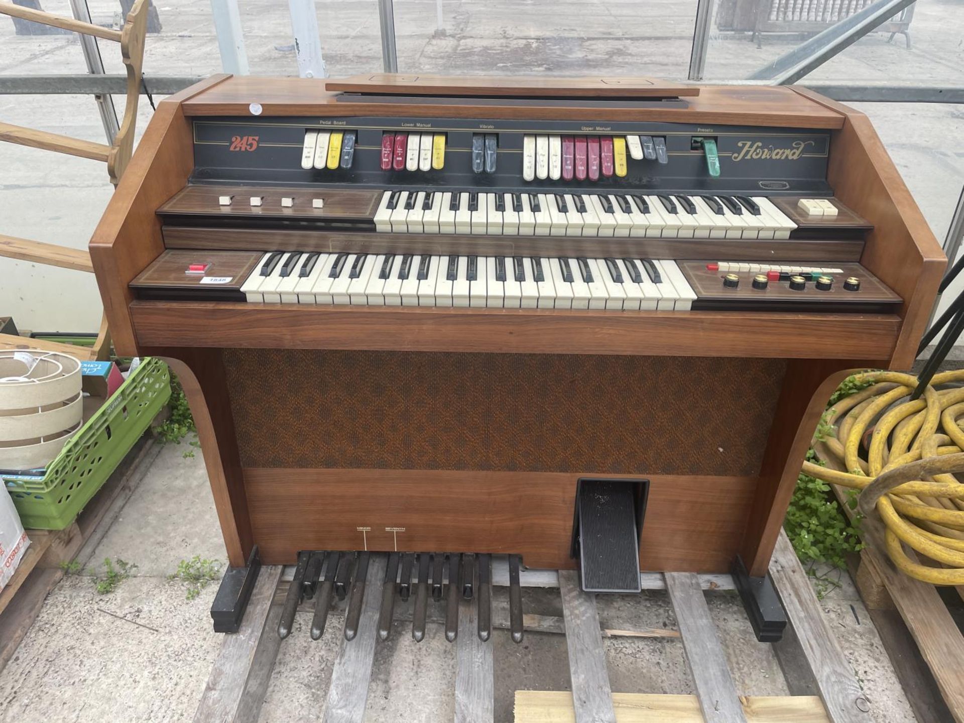 A HOWARD 245 ELECTRIC ORGAN BELIEVED IN WORKING ORDER BUT NO WARRANTY