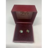A PAIR OF 9 CARAT GOLD EARRINGS WITH AQUA STONES IN A PRESENTATION BOX