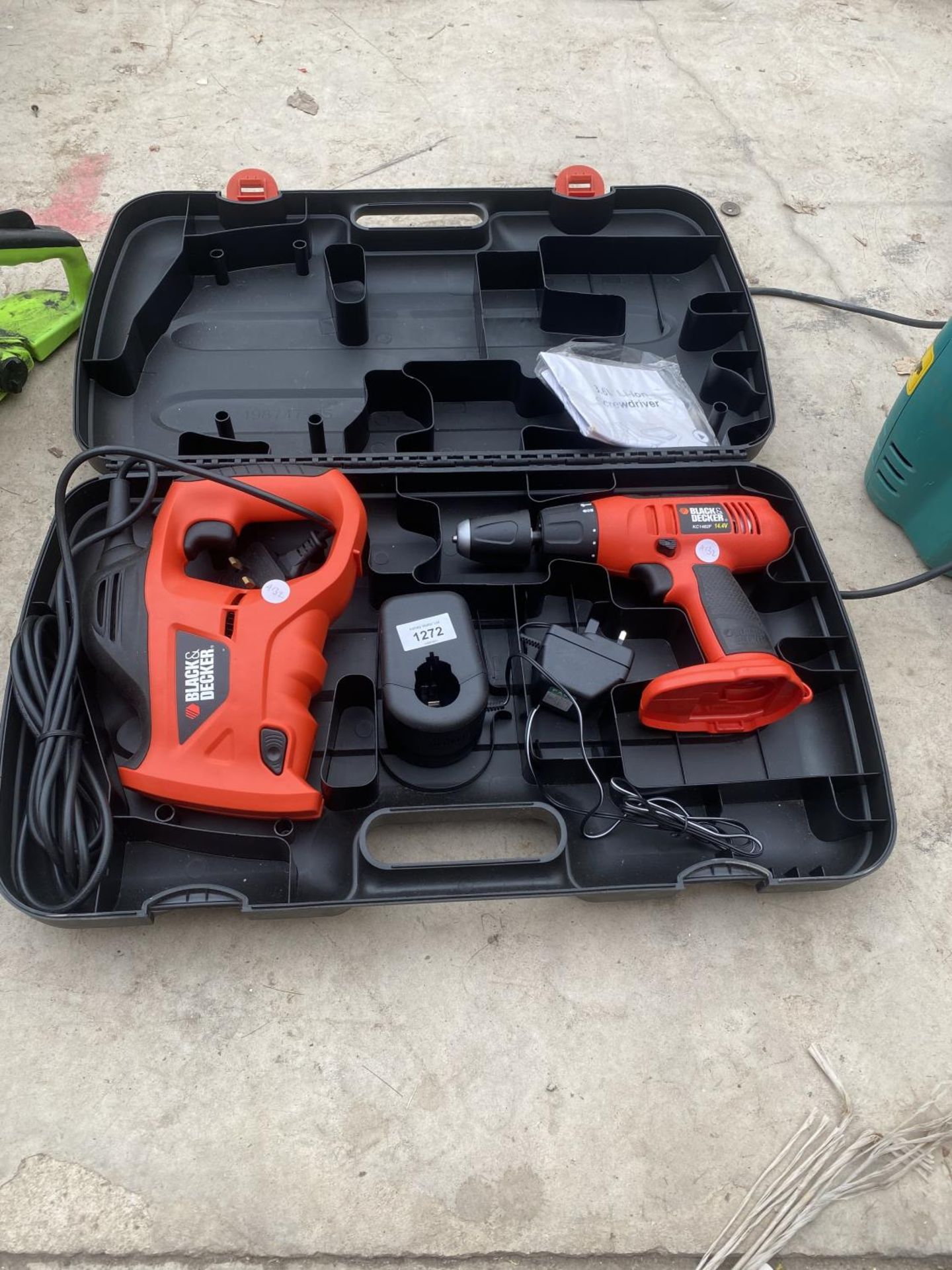 A BLACK AND DECKER SET WITH A DRILL AND A SAW