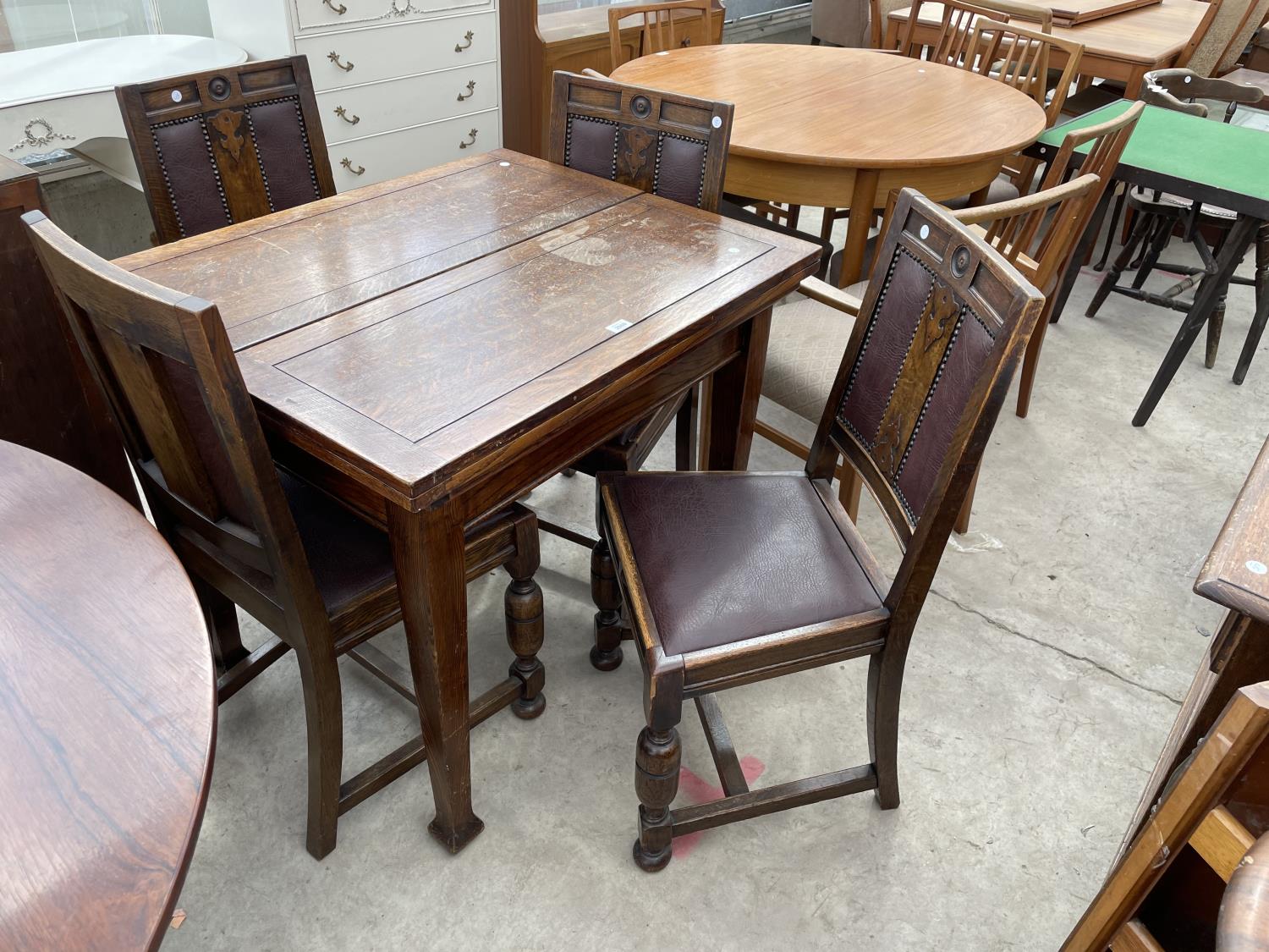AN EARLY 20TH CENTURY OAK FOLD-OVER DINING TABLE WITH SCISSOR ACTION MECHANISM (PATENT NO.382428)