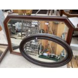 AN OVAL WOODEN FRAMED BEVELED EDGE MIRROR AND A FURTHER WOODEN FRAMED MIRROR