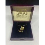 A BOXED 9 CARAT GOLD NECKLACE WITH A TRIPLE FOB TO INCLUDE AN ANCHOR, HEART AND CROSS