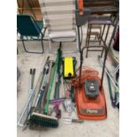 AN ASSORTMENT OF GARDEN TOOLS TO INCLUDE A FLYMO LAWN MOWER, FORKS, SHOVELS AND HOES ETC