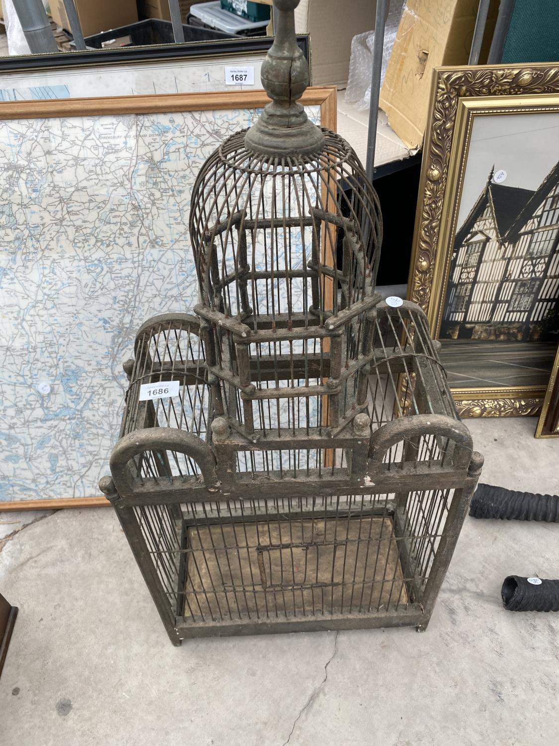 A VINTAGE AND DECORATIVE BIRD CAGE