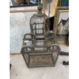 A VINTAGE AND DECORATIVE BIRD CAGE