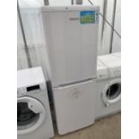 A WHITE BEKO UPRIGHT FRIDGE FREEZER BELIEVED IN WORKING ORDER BUT NO WARRANTY