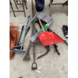 AN ASSORTMENT OF GARDEN TOOLS TO INCLUDE A SNOW SHOVEL,RAKES AND LOPPERS ETC