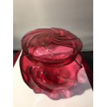 A CRANBERRY GLASS LIDDED POT