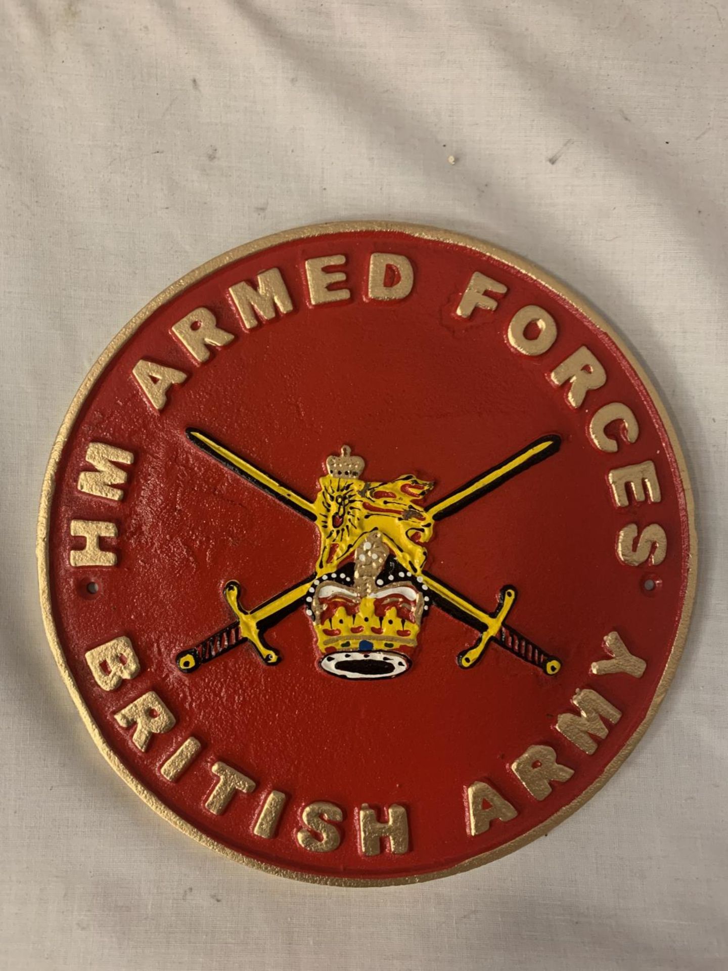 A CAST CIRCULAR BRITISH ARMY SIGN