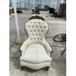 A CONTINENTAL WALNUT FRAMED BUTTON BACK NURING CHAIR
