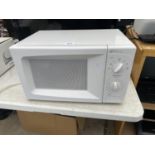 A WHITE DAEWOO MICROWAVE OVEN