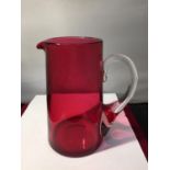 A CRANBERRY GLASS JUG