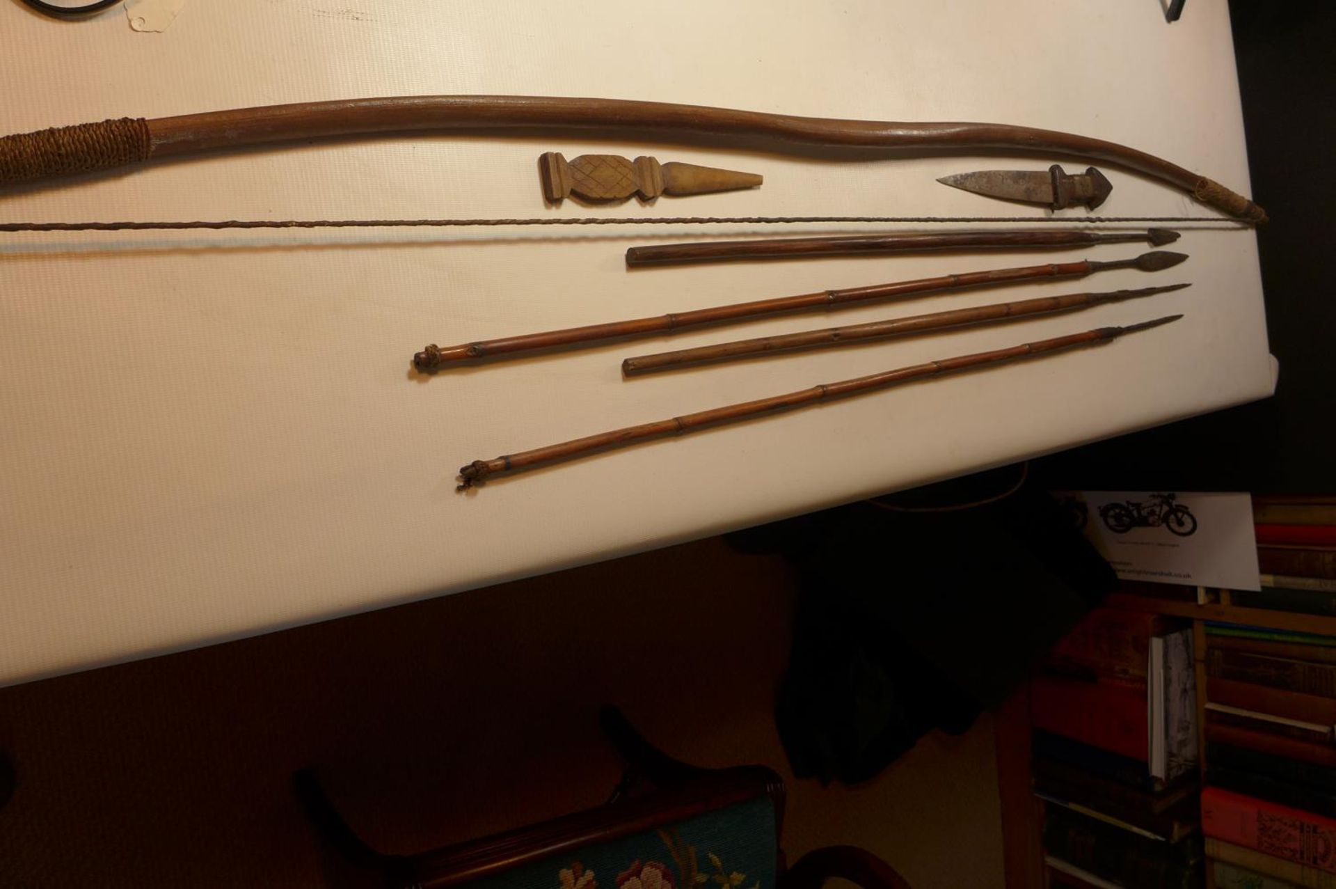 AN AFRICAN BOW, LENGTH 151CM 2 SPEARS, 2 FISHING SPEARS, AN AFRICAN KNIFE AND A WOODEN KNIFE