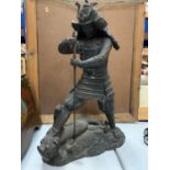 A VERY HEAVY BRONZE FIGURE OF A SAMURAI WARRIOR