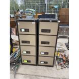 A PAIR OF FOUR DRAWER METAL FILING CABINETS