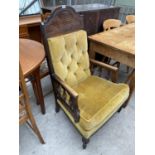 A VICTORIAN STYLE FIRESIDE CHAIR WITH BUTTON BACK