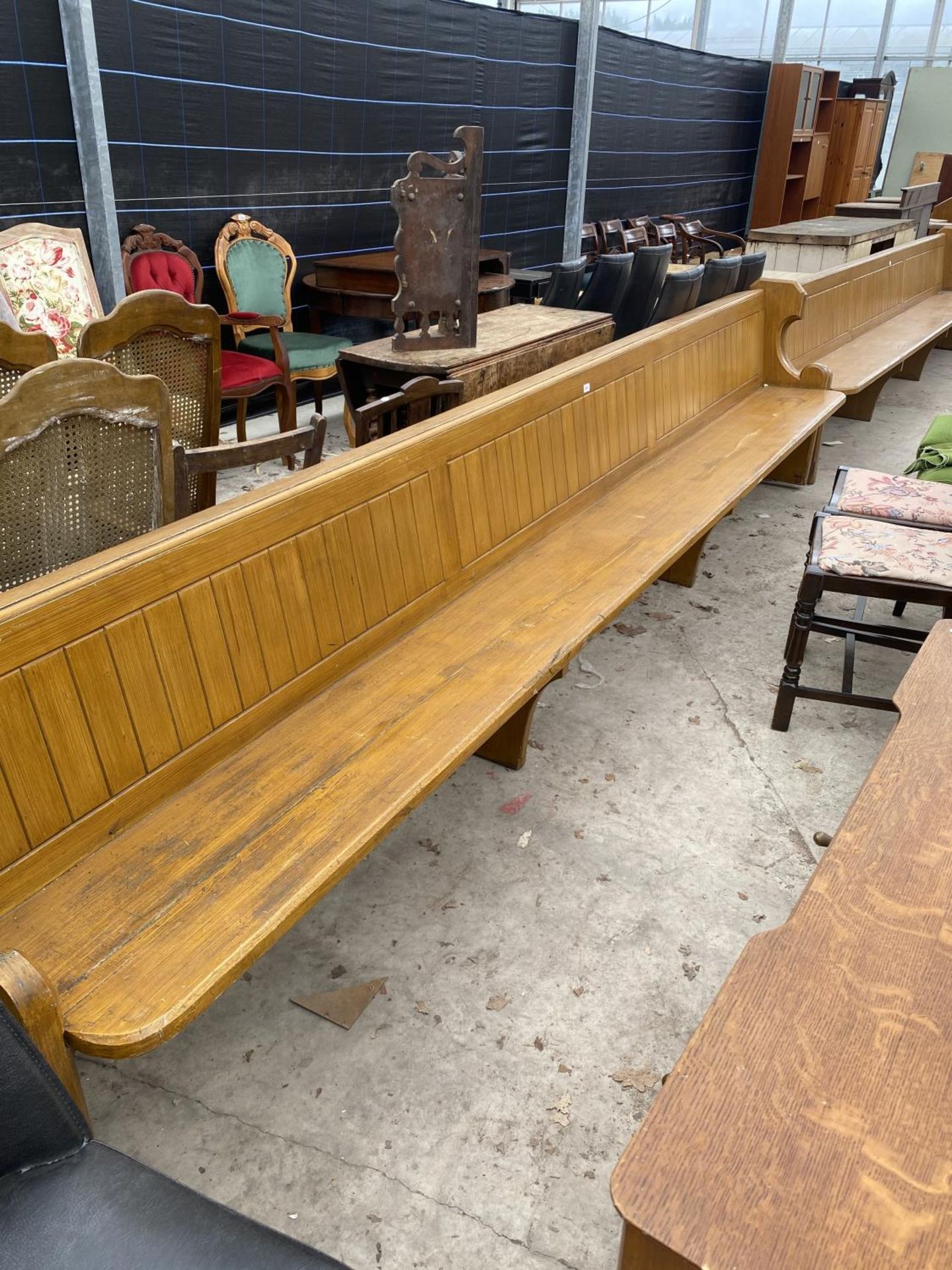 A VICTORIAN PINE OAK GRAINED PEW, 156" WIDE