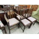 A SET OF SIX LATH BACK DINING CHAIRS, ONE BEING A CARVER