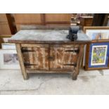 A WOODEN WORK BENCH WITH LOWER TWO DOOR CUPBOARD AND A RECORD NO.4 BENCH VICE