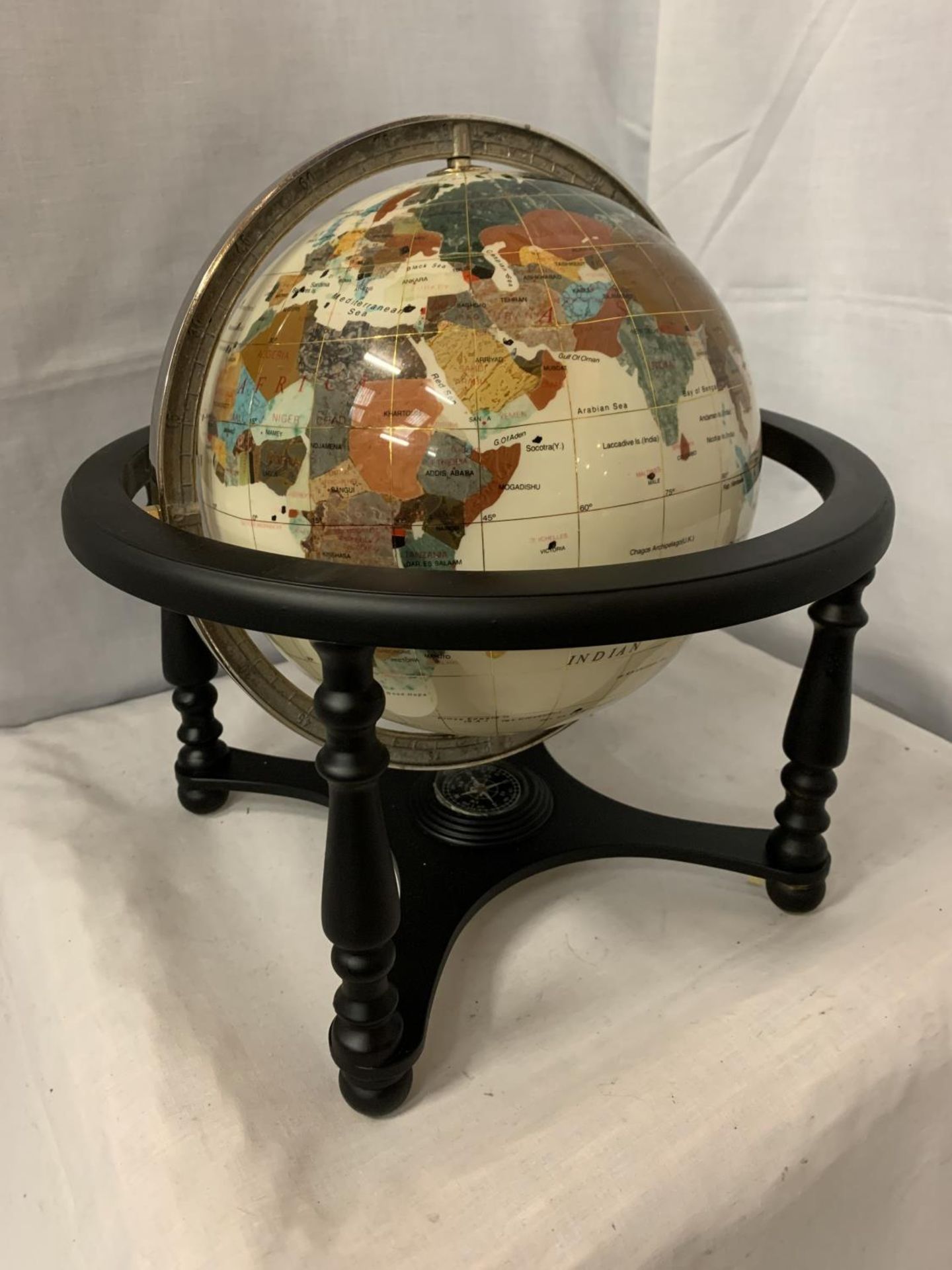 A WORLD GLOBE ON A STAND WITH SEMI PRECIOUS STONES AND AGATE