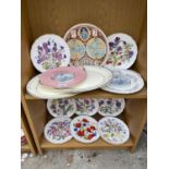 AN ASSORTMENT OF CERAMIC PLATES WITH FLORAL DESIGN