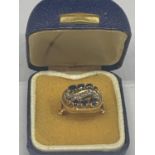 A 14 CARAT YELLOW GOLD RING WITH SAPPHIRES AND DIAMONDS IN A DECO STYLE SETTING GROSS WEIGHT 6 GRAMS