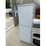 A WHITE HOTPOINT UPRIGHT FRIDGE FREEZER BELIEVED IN WORKING ORDER BUT NO WARRANTY