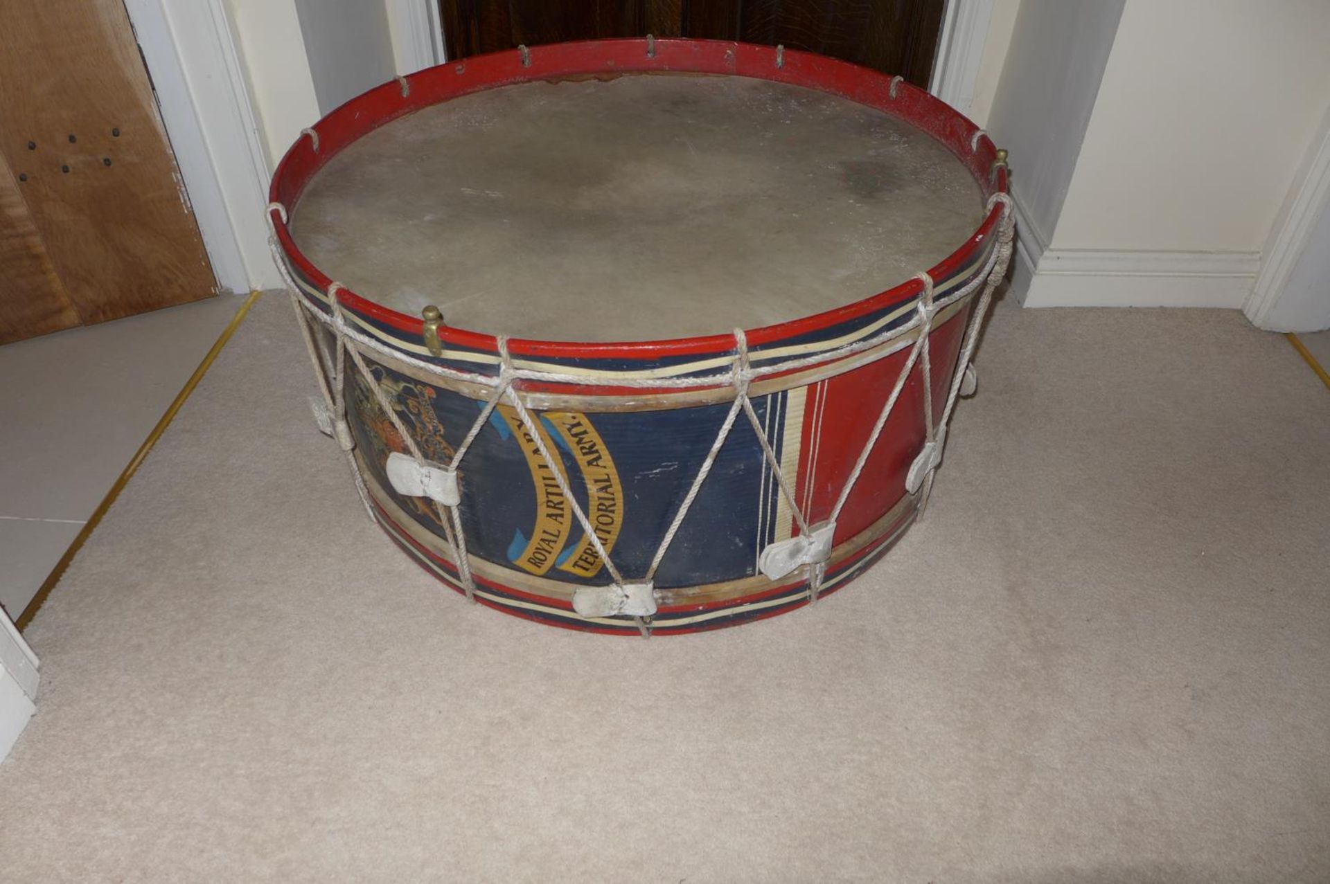 A LARGE EARLY 20TH CENTURY ROYAL ARTILLARY REGIMENTAL BASS DRUM, 82 CM DIAMETER, WITH ROYAL COAT