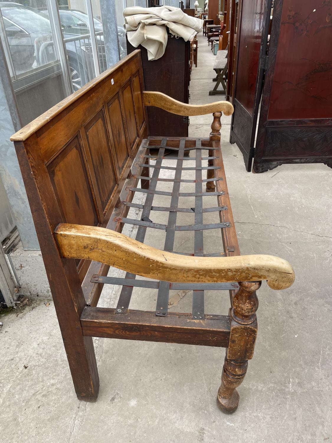 A VICTORIAN PINE SETTLE WITH FIVE PANEL BACK, 71.5" WIDE, ON TURNED FRONT LEGS - Image 11 of 11