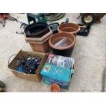 AN ASSORTMENT OF GARDEN ITEMS TO INCLUDE PLANTERS, A WATERING CAN AND LIGHTS ETC