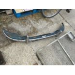 A CHROME CAR BUMPER BELIEVED TO BE FROM A MORRIS MINOR