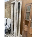 A SET OF THREE WOODEN DOOR FRAMES, ONE WITH GLASS PAIN (H:227CM)