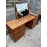 A MODERN TEAK KNEEHOLE DRESSING TABLE ENCLOSING SIX DRAWERS, COMPLETE WITH TRIPLE MIRROR, 61" WIDE