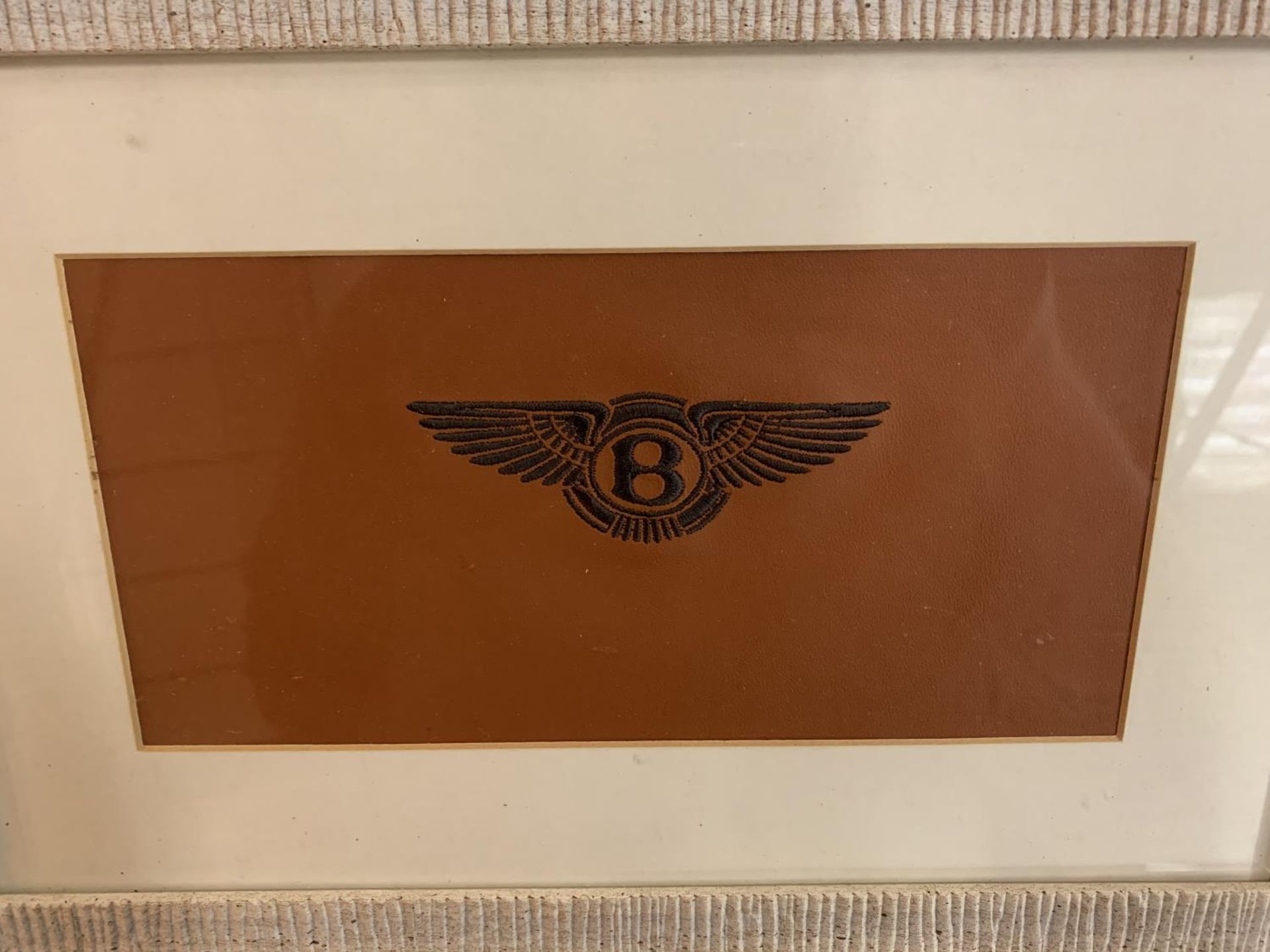 A FRAMED TAN LEATHER WITH EMBROIDERED BENTLEY LOGO - Image 2 of 2