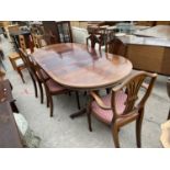 A REGENCY STYLE MAHOGANY AND CROSSBANDED DINING TABLE AND SIX CHAIRS