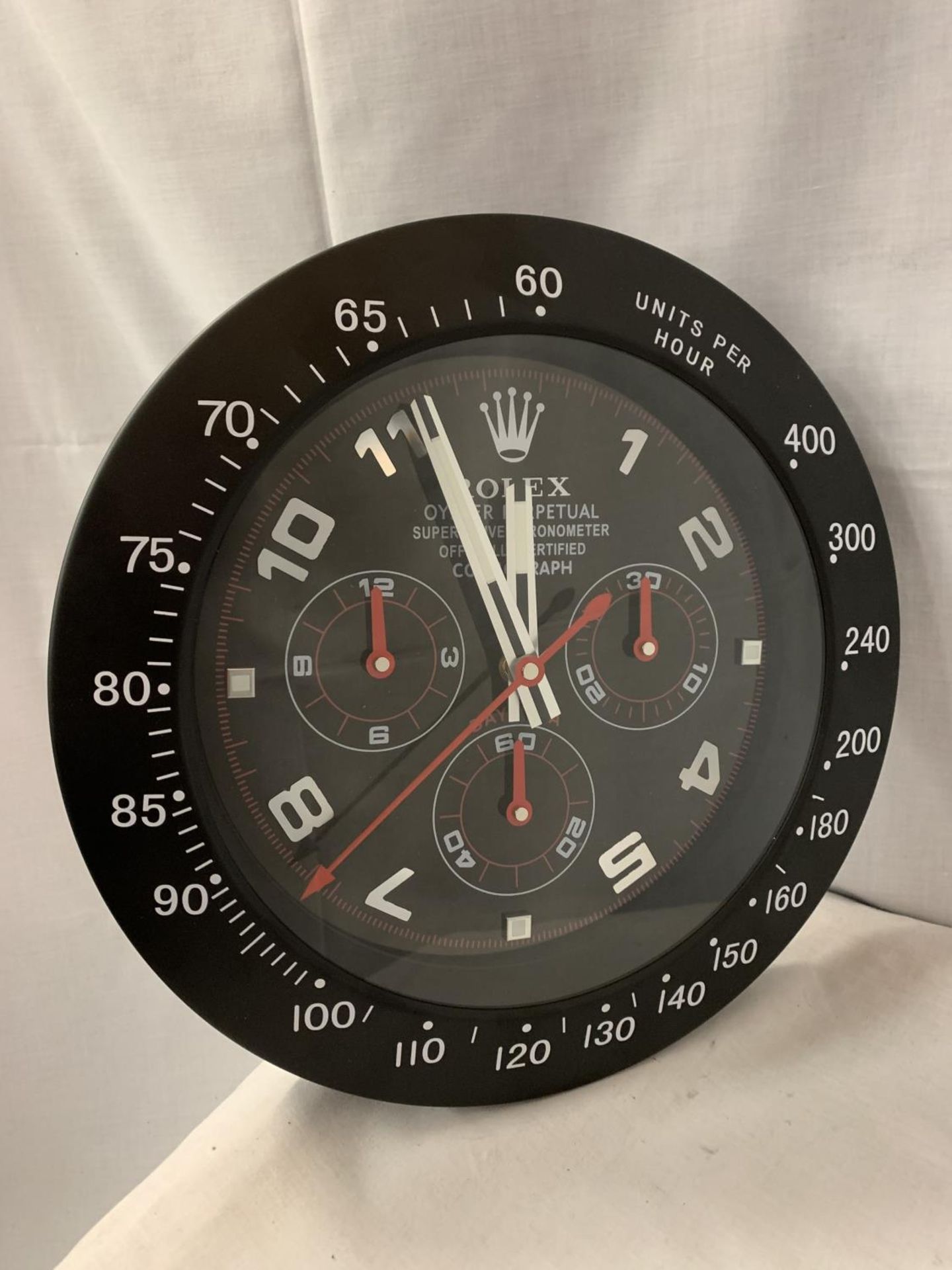 A LARGE DEALERS WALL CLOCK