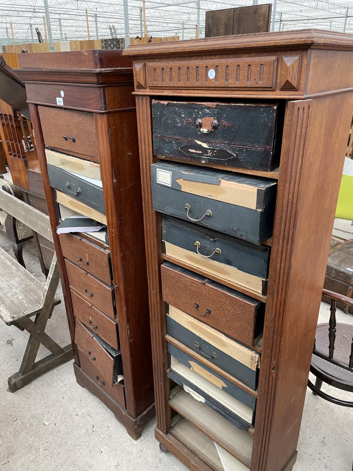 TWO WELLINGTON STYLE CHESTS WITH COMPRESSED FIBRE DRAWERS (TWO MISSING)