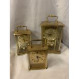 THREE BRASS CARRIAGE CLOCKS OF HEIGHTS 21CM, 16CM, 13CM.