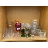 AN ASSORTMENT OF GLASS WARE TO INCLUDE TUMBLERS, WINE GLASSES AND A JUG ETC
