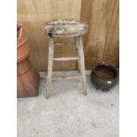 AN INDUSTRIAL STYLE VINTAGE FOUR LEGGED WORK BENCH STOOL