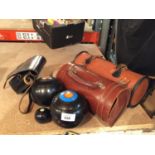 TWO LEATHER BAGS OF BOWLING BALLS